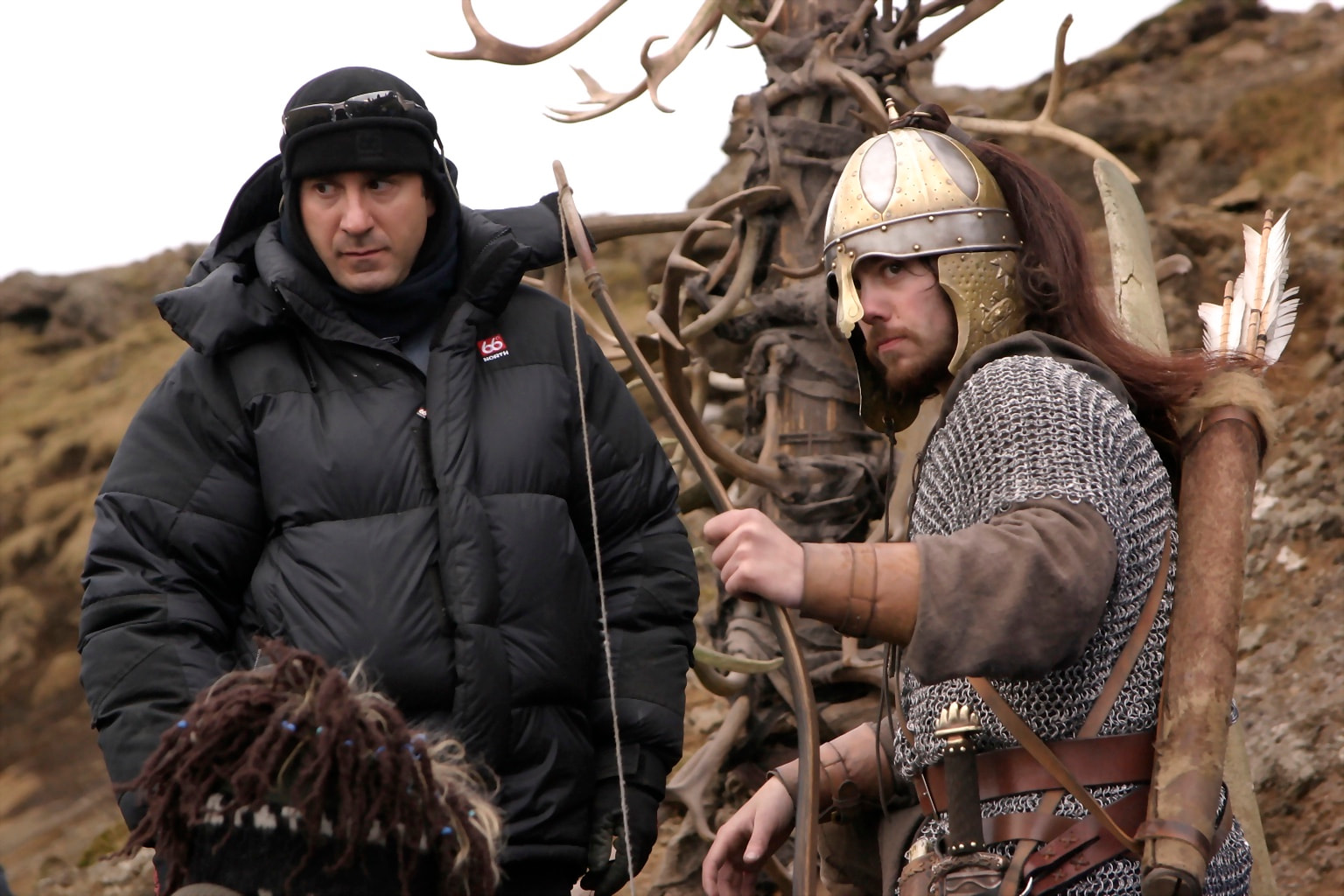 Peter Pedrero working beside a costumed archer — Beowulf & Grendel