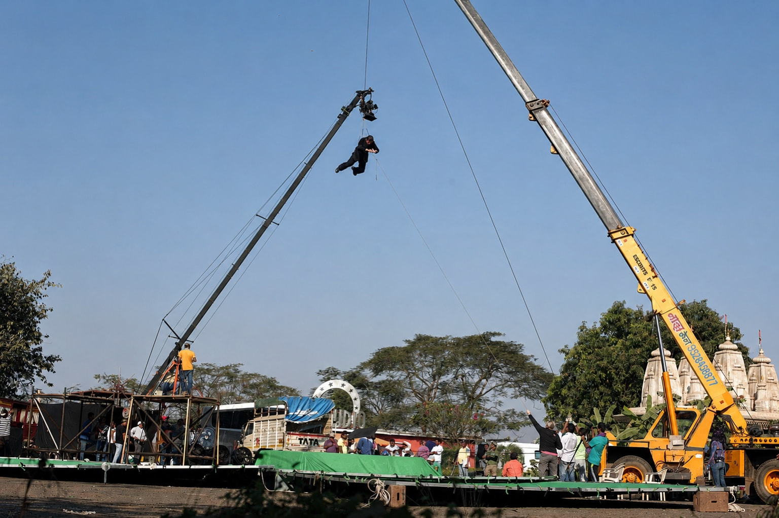 Wire stunt filmed between cranes