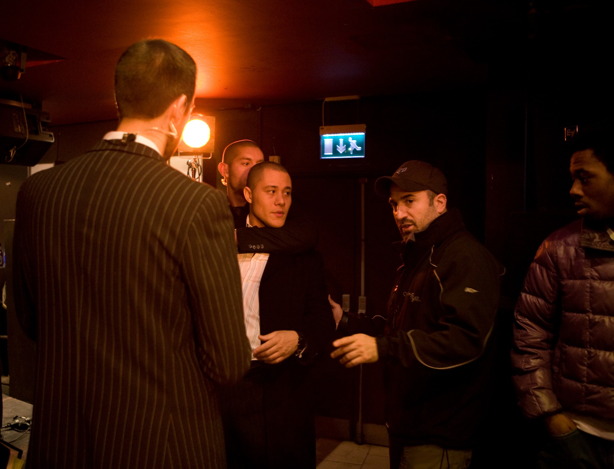 Peter Pedrero in discussion with cast and crew on set — Baseline