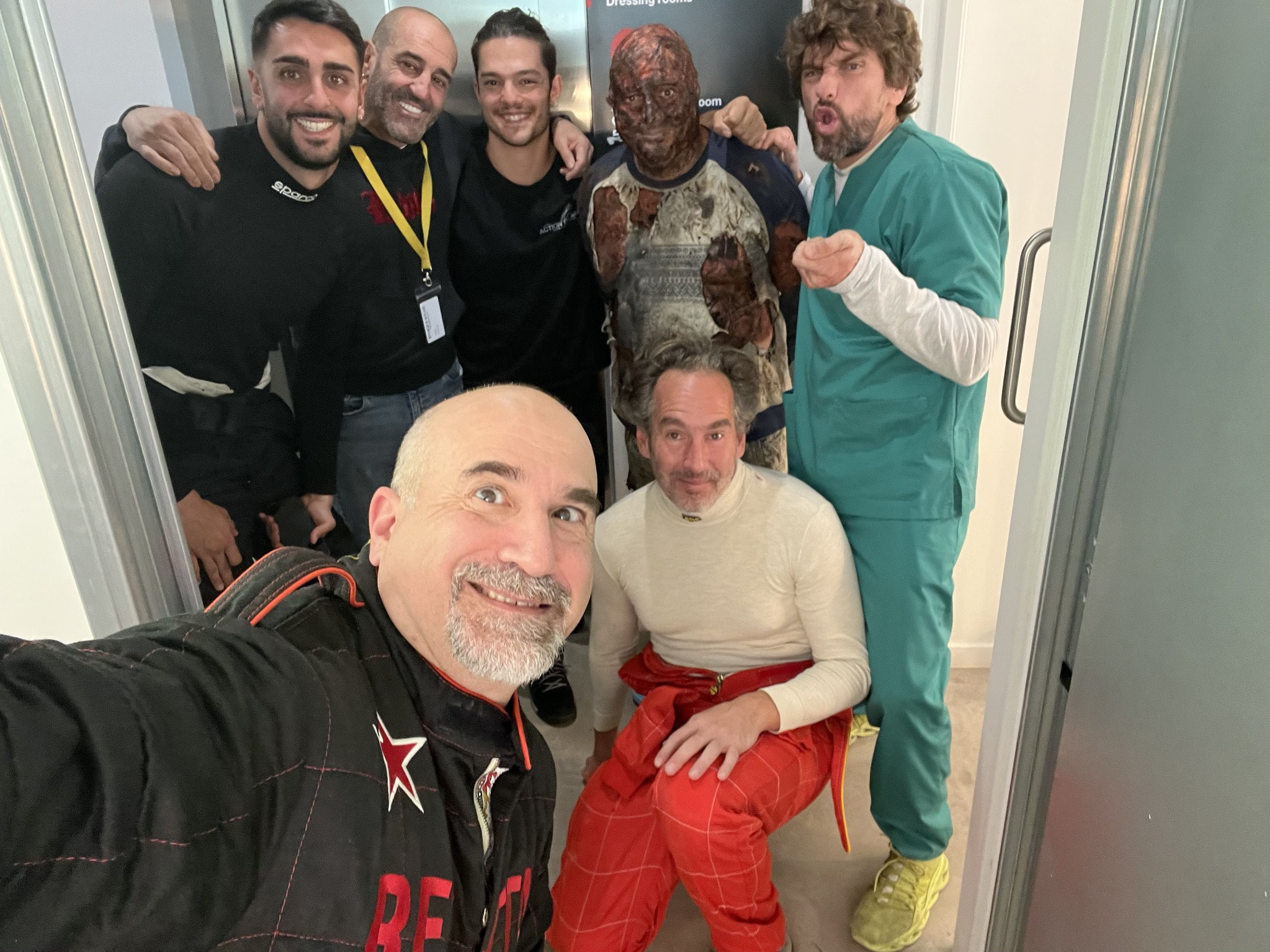 Peter Pedrero with cast and crew after an action sequence — 1992