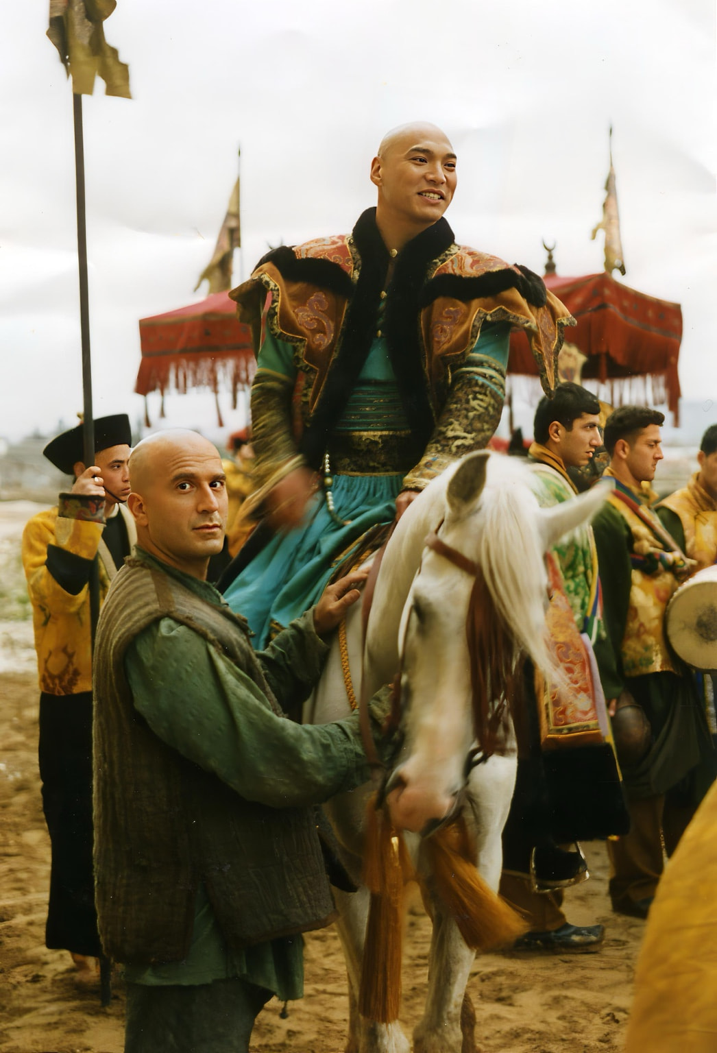 Peter Pedrero beside a mounted performer on set — Arabian Nights