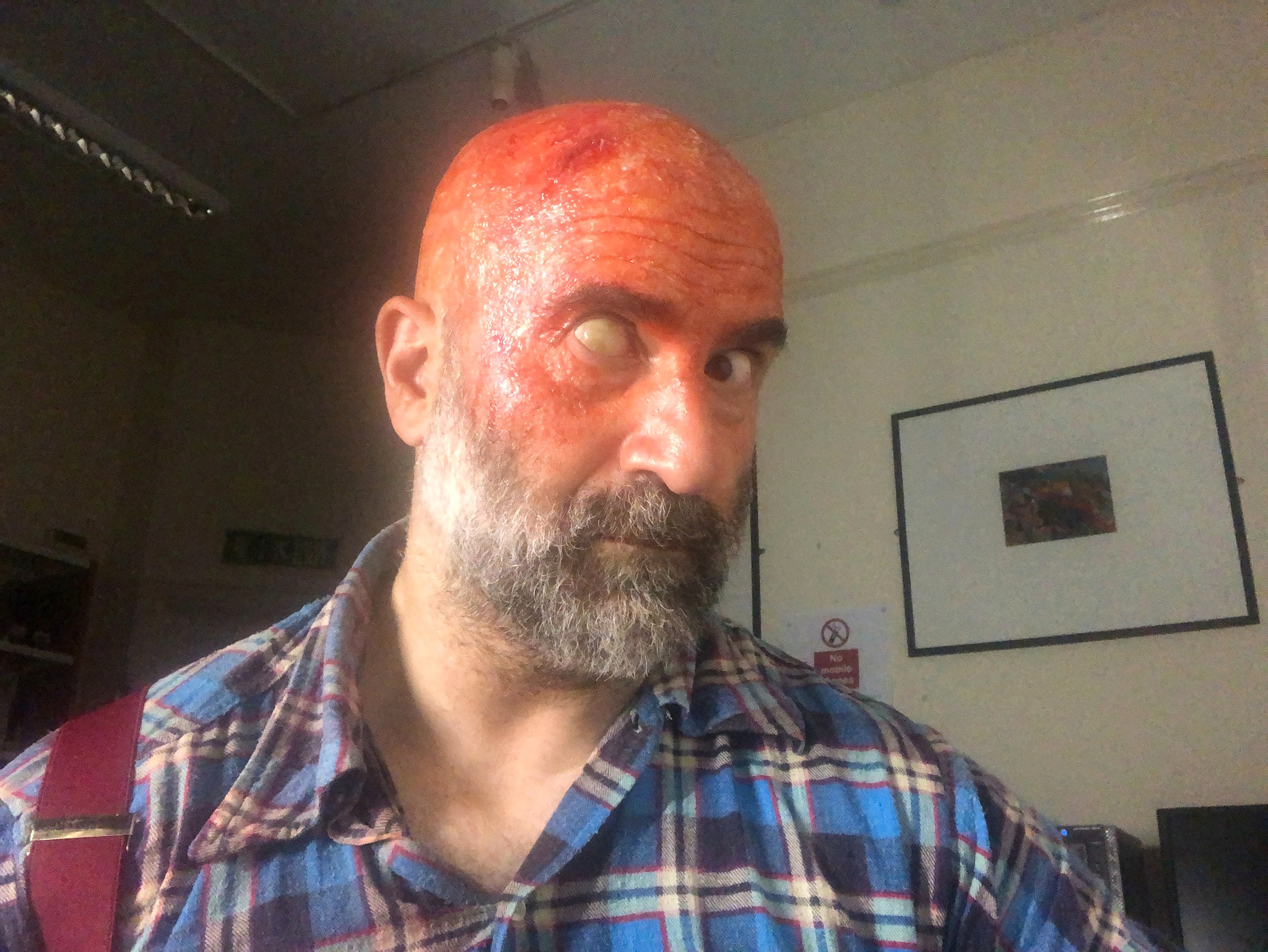 Peter Pedrero alone in prosthetic make-up with an opaque contact lens — Slaughterhouse Rulez