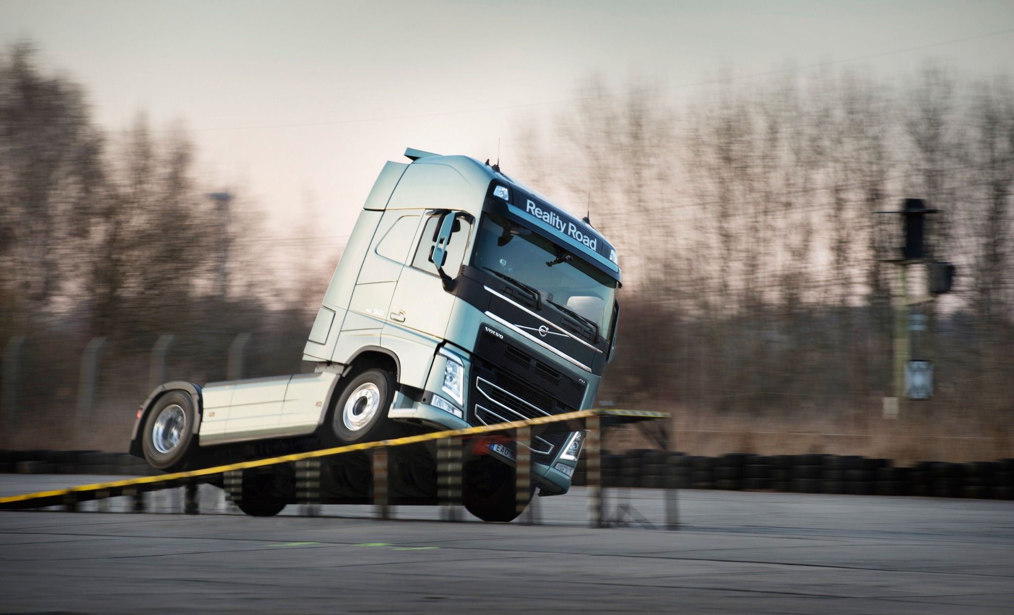 A Volvo truck performing a controlled two-wheel stunt — Volvo (commercials)