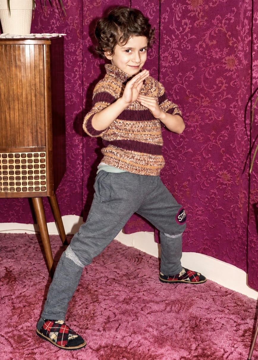 A young Peter Pedrero striking an early martial arts pose at home