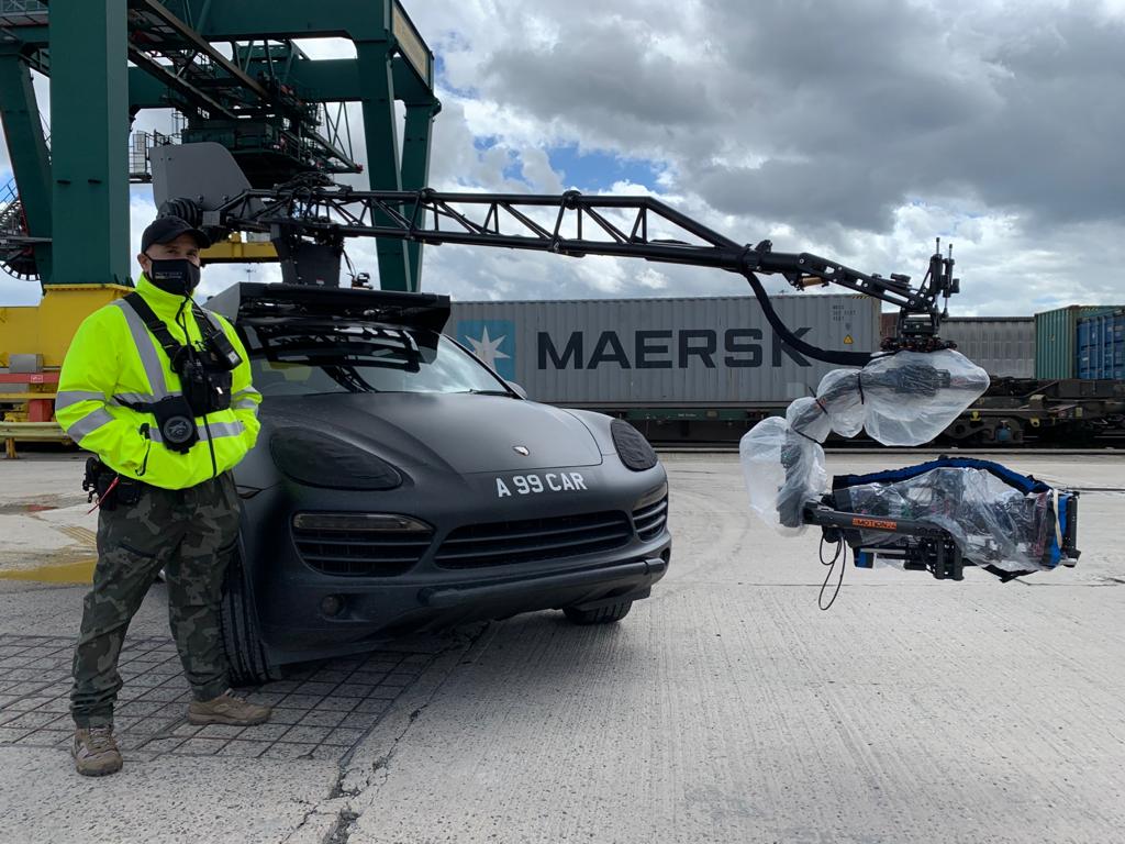 Peter Pedrero beside the pursuit vehicle and Ultra Arm camera rig on the Ruroc Helmets commercial