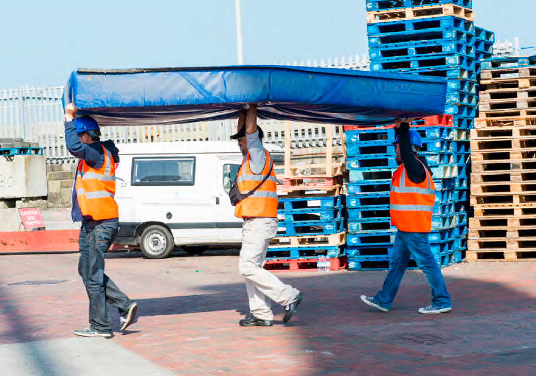 The stunt team carrying the crash mat into position for the Specsavers Film4 Stuntman ident